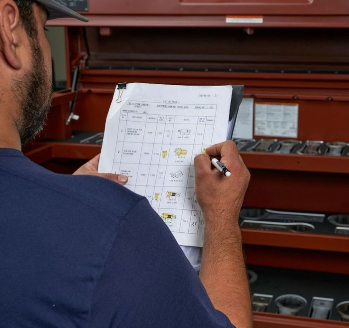 Technician checking inventory inside an ICON industrial kit box